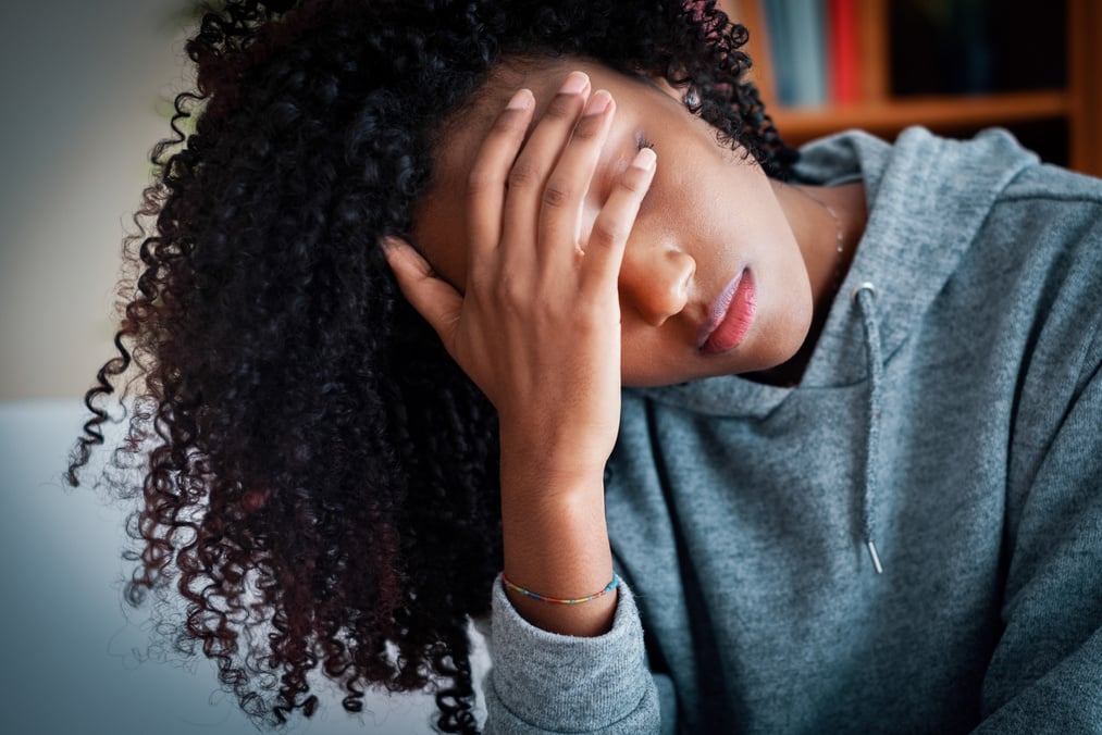 Difficult black teenage girl feeling sad and anxious